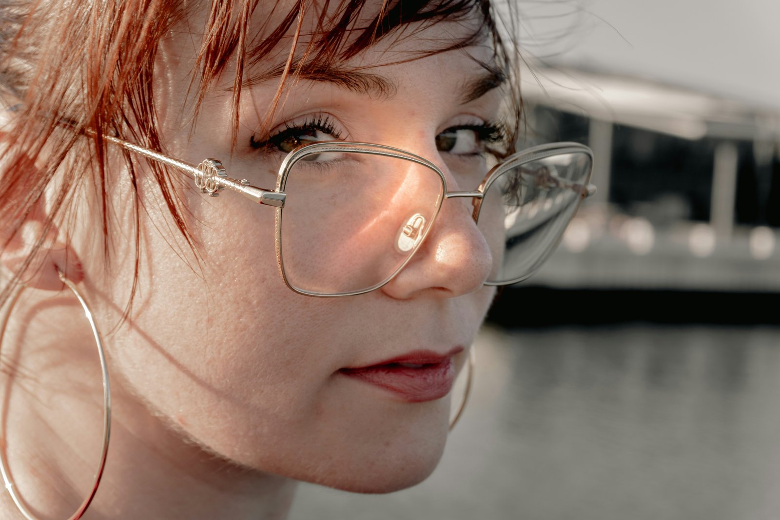 Woman wearing eyewear in profile